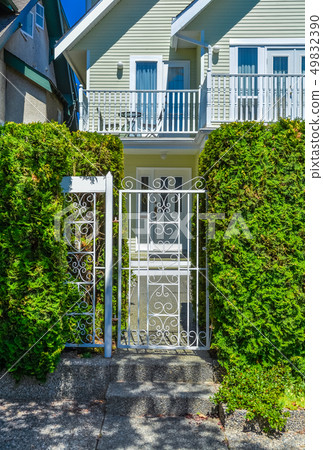 Decorated metal gate of residential house entrance. Decorated metal gate of residential house entrance. 49832390