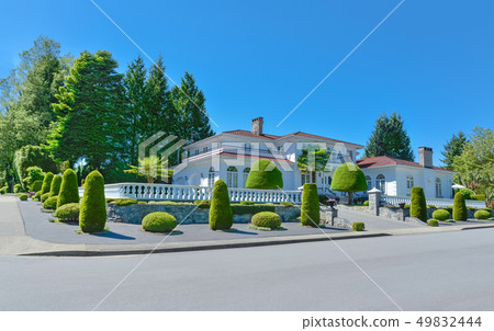 Luxury residential house fenced with white balustrade on the top of terrace Luxury residential house fenced with white balustrade on the top of terrace 49832444