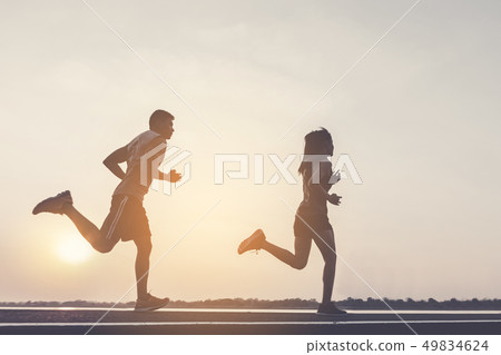 runner running on running road in city 49834624