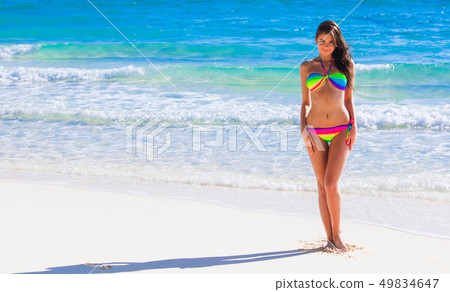 Pretty girl at the beach 49834647