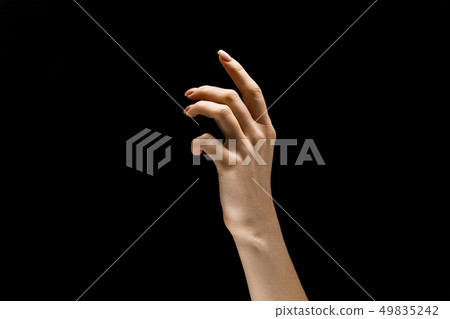 Female hand demonstrating a gesture of getting touch isolated on gray background Female hand demonstrating a gesture of getting touch isolated on gray background 49835242