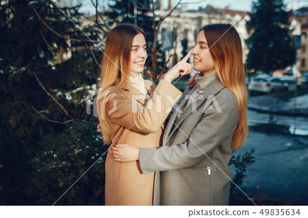 Two beautiful girls in a city 49835634