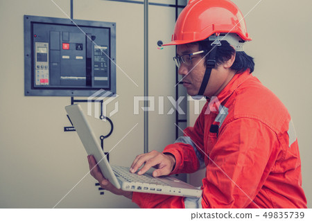 engineer in solar power plant  49835739