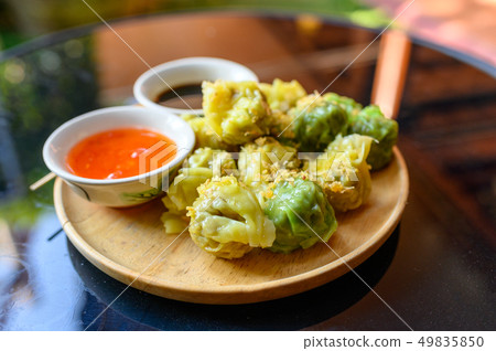 Yellow and green dumpling dim sum stuffed with Yellow and green dumpling dim sum stuffed with 49835850