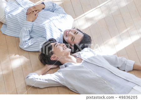 Smiling couple sleeping on the floor 49836205