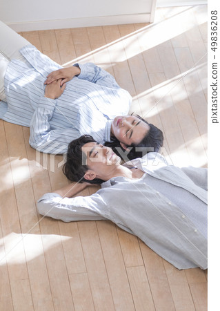 Couple sleeping on the floor 49836208