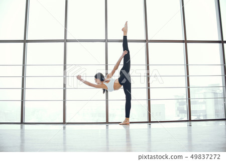 Beautiful and elegant girl doing yoga Beautiful and elegant girl doing yoga 49837272