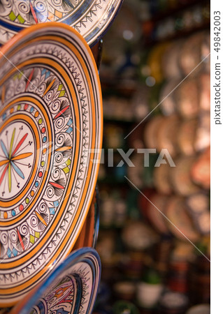 Traditional ceramic pottery on the wall of Morocco bazaar, Marakesh 49842003