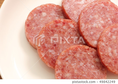 A round slice of salami (soft salami). A round slice of salami (soft salami). 49842249