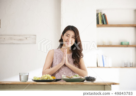 Health care young woman eating meal 49843783