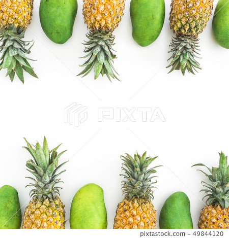 Frame of pineapple and mango fruits on white 49844120