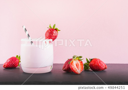 Strawberry milkshake with berry. Close up. Summer pink drink. Strawberry milkshake with berry. Close up. Summer pink drink. 49844251