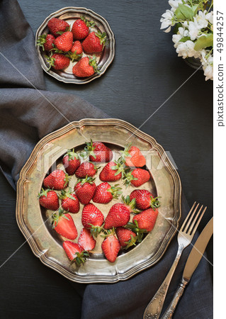 Sweet organic strawberry in vintage plate on dark. Summer. Top view. Sweet organic strawberry in vintage plate on dark. Summer. Top view. 49844257