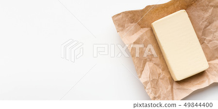 Block of butter on white Block of butter on white 49844400