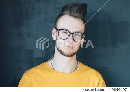 strict disappointed emotional hipster guy portrait 49844497
