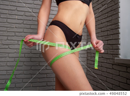 the girl measures the girl measures 49848552