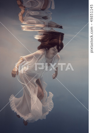 Portrait of a girl in a white dress under water Portrait of a girl in a white dress under water 49851145