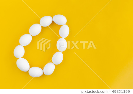 White chicken eggs lie in the shape of a big egg 49851399
