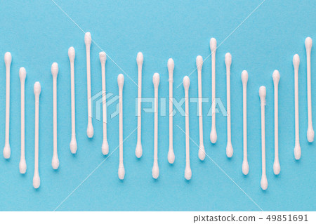 cotton sticks texture on blue background, top view 49851691