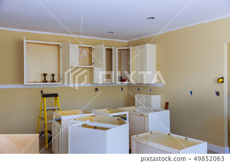 Custom kitchen cabinets in various stages 49852063