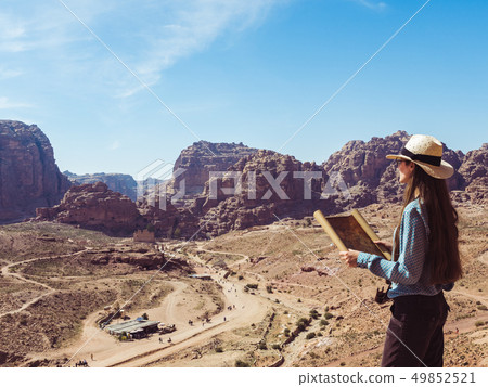 Woman exploring the sights city of Petra Woman exploring the sights city of Petra 49852521