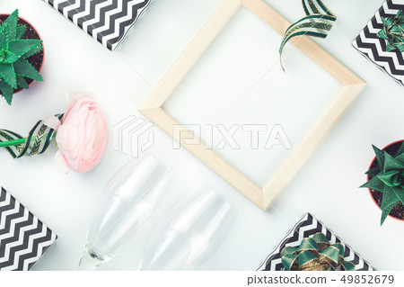 Black and white chevron gift boxes with green bows 49852679