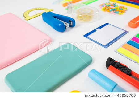Phone cases and stationary things placed on the floor Phone cases and stationary things placed on the floor 49852709