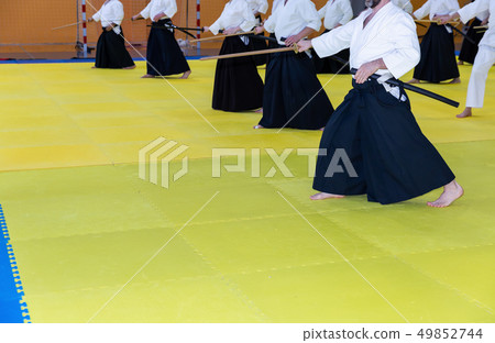 People in kimono on martial arts weapon training seminar 49852744