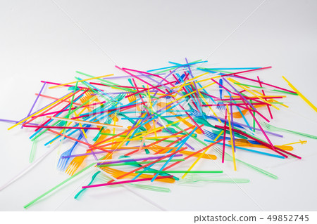 Bunch of colorful toxic straws chaotically thrown on the floor 49852745