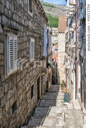 Narrow street in Dubrovnik on a summer day, Croatia Narrow street in Dubrovnik on a summer day, Croatia 49853704