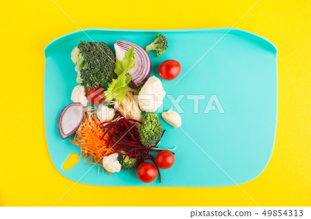 Cut ingredients for salad, soup, smoothie Cut ingredients for salad, soup, smoothie 49854313