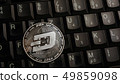 Silver dash coin over  laptop keyboard 49859098