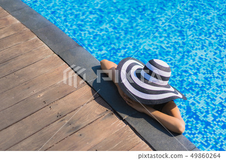Portrait beautiful young asian woman happy smile relax around swimming pool in hotel resort Portrait beautiful young asian woman happy smile relax around swimming pool in hotel resort 49860264