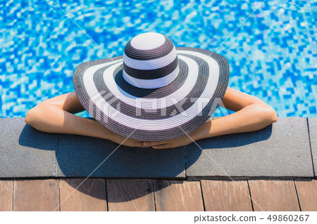 Beautiful young asian woman happy smile and relax in swimming pool Beautiful young asian woman happy smile and relax in swimming pool 49860267