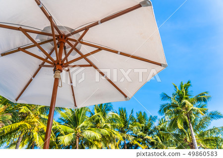Beautiful landscape of sea ocean on sky with umbrella and chair around luxury outdoor swimming pool Beautiful landscape of sea ocean on sky with umbrella and chair around luxury outdoor swimming pool 49860583