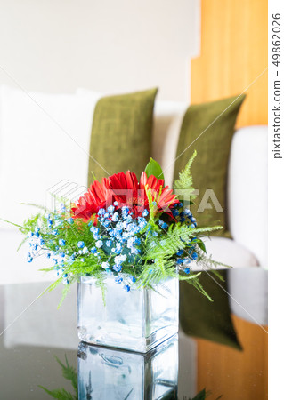 Vase flower on table with pillow on sofa decoration Vase flower on table with pillow on sofa decoration 49862026
