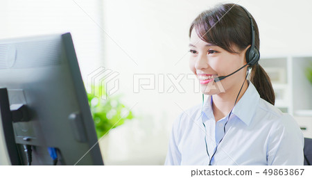 business woman wearing headset 49863867