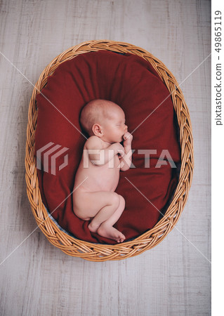 newborn baby wrapped in a blanket sleeping newborn baby wrapped in a blanket sleeping 49865119