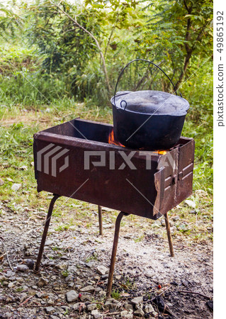 cauldron on grill cauldron on grill 49865192