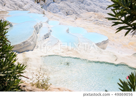 Travertines with turquoise water in Pamukkale. 49869056