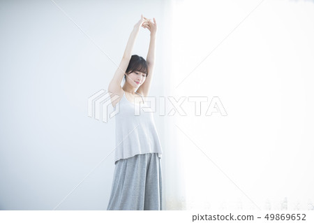 Young Woman Stretching Arms 49869652