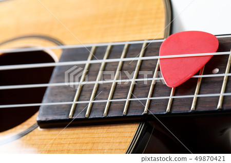 Small Hawaiian four stringed ukulele guitar Small Hawaiian four stringed ukulele guitar 49870421