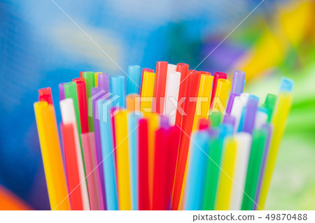 Disposable plastic straws being bright and colorful 49870488