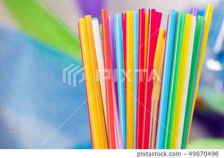 Straws of different bright colors collected in a pile Straws of different bright colors collected in a pile 49870496