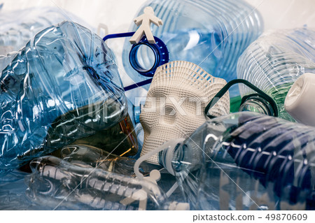 Plastic models of people and skull lying in a pile of plastic garbage Plastic models of people and skull lying in a pile of plastic garbage 49870609