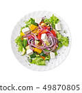 Greek Salad on a plate, isolated on white background. Top view. 49870805