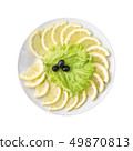 Sliced lemon on a plate, isolated on white background. Top view. 49870813