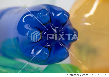 Empty blue plastic bottle presenting environmental catastrophe Empty blue plastic bottle presenting environmental catastrophe 49871134