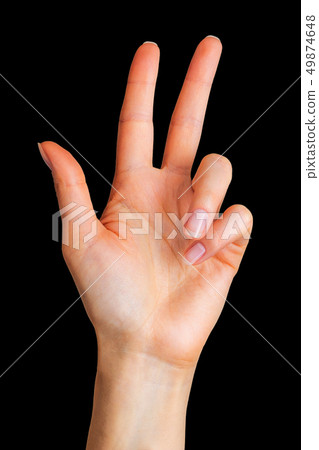Female hand showing 3 fingers in gesture of order beer in Germany 49874648
