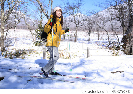 Woman enjoying winter leisure Woman enjoying winter leisure 49875088
